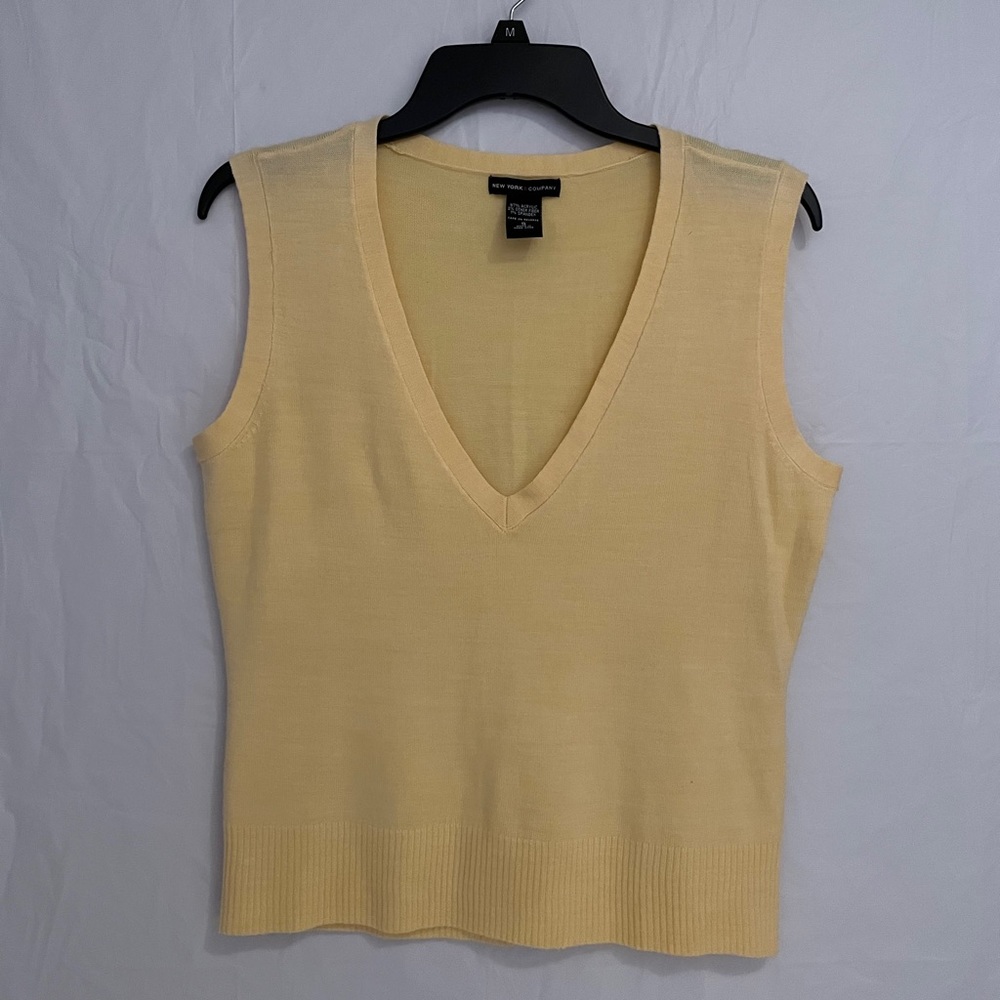 yellow sweater vest